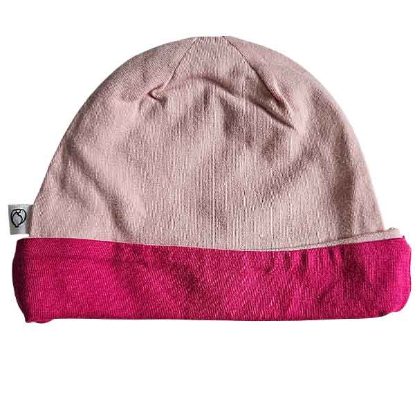 Studio Spruitje tweedehands babymutsje roze met fuchsia omslagrand van zachte jersey stof.