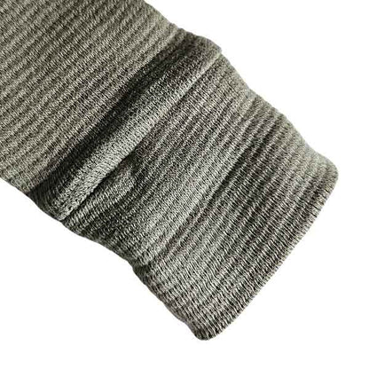 Studio Spruitje tweedehands babyshirt groen met houten knoopjes en lange mouwen.