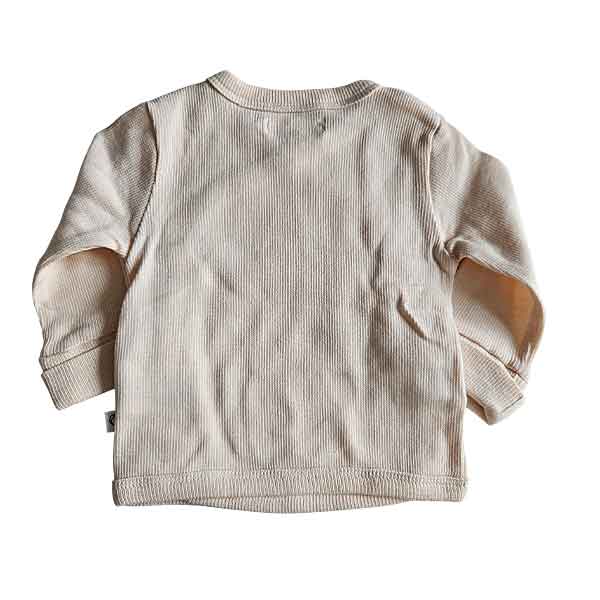 Studio Spruitje tweedehands baby overslagshirt in poederroze ribstof met lange mouwen.